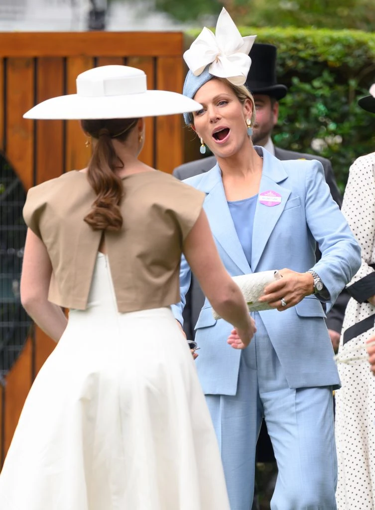 eugenie and zara chatting at royal ascot